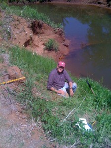 Dr. Jim Nevels takes samples for a pedological project.