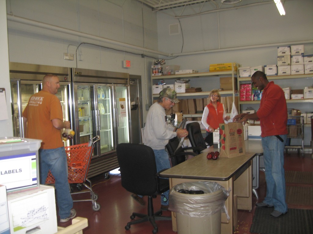 RRCc employees help stock food at the Hope Center