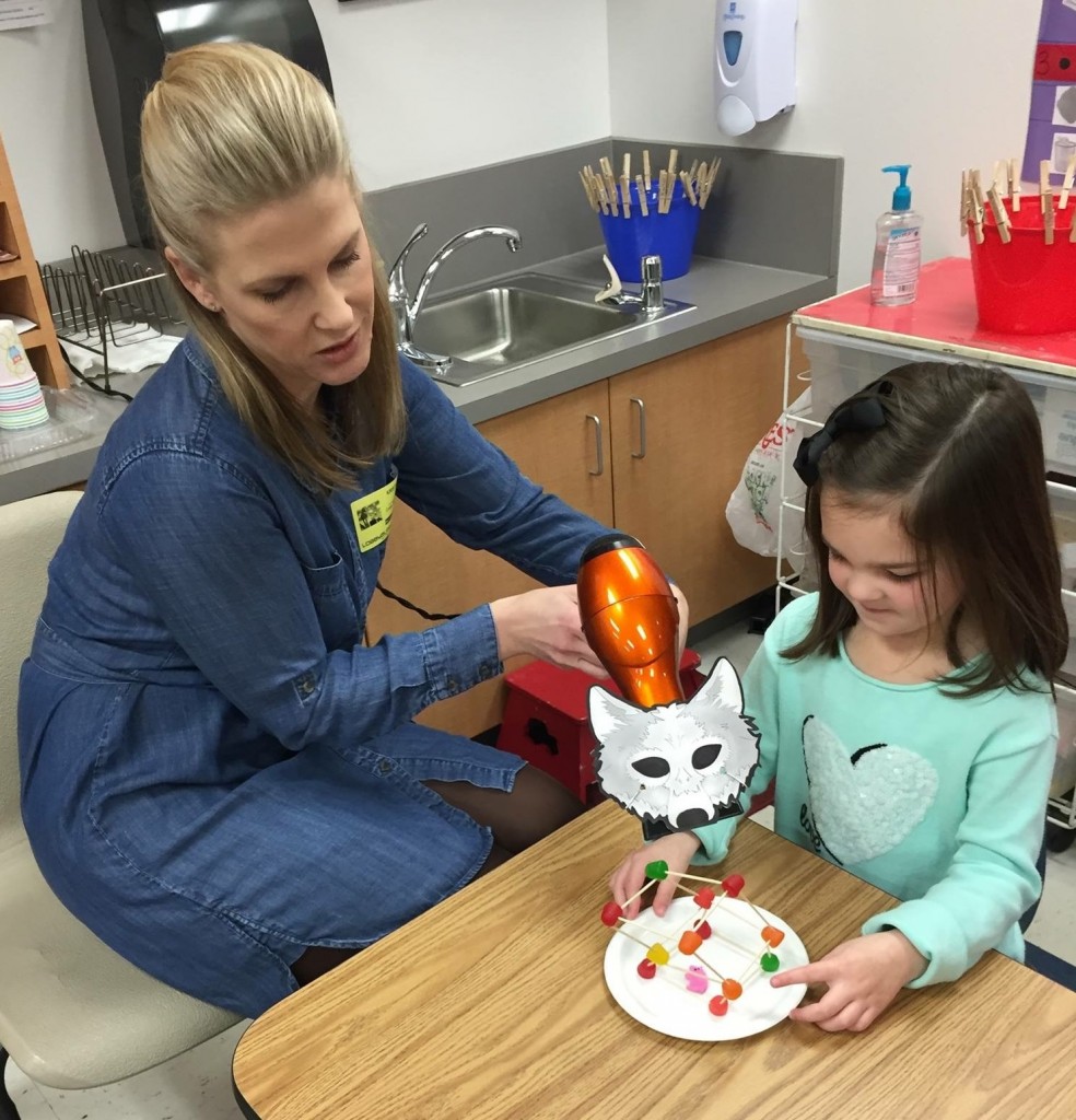 Kristi Bumpas and the Big Bad Wolf demonstrate a wind load on the residential structure of a pre-K student